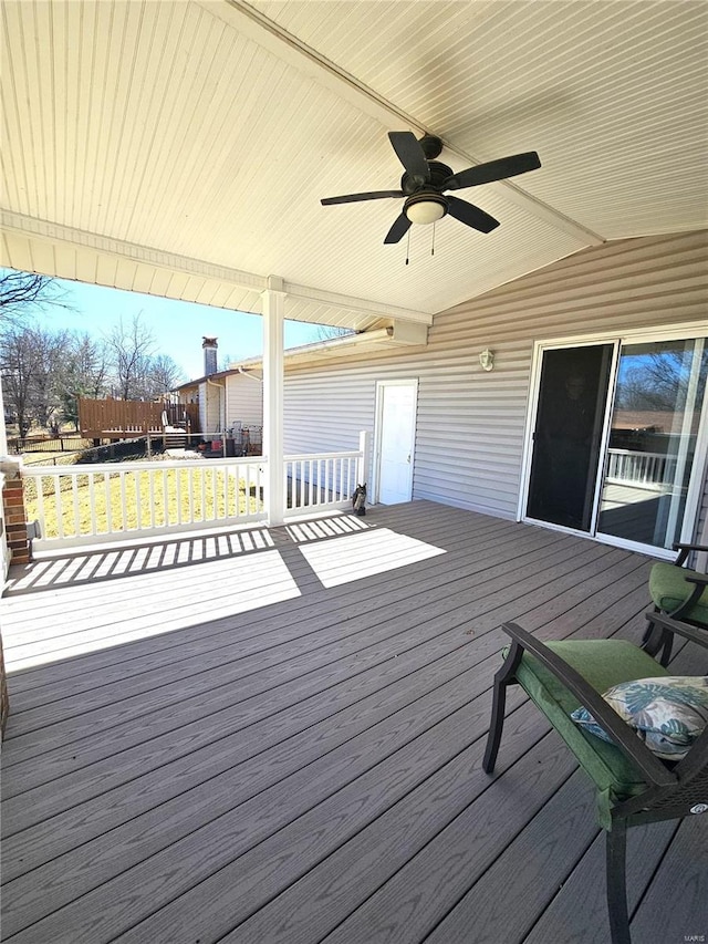 wooden terrace featuring ceiling fan