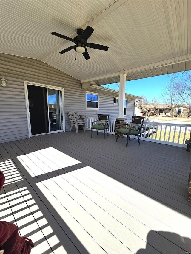 wooden deck featuring ceiling fan