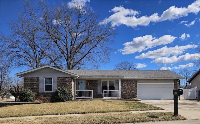 ranch-style house with fence, driveway, covered porch, a garage, and brick siding