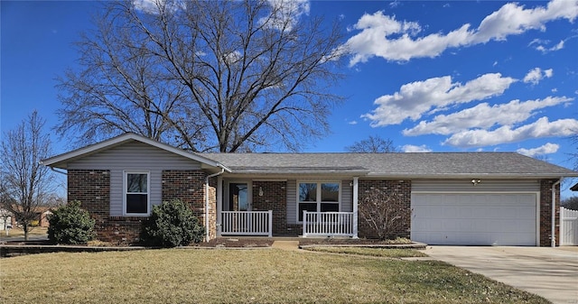 single story home featuring brick siding, a porch, concrete driveway, a front yard, and an attached garage