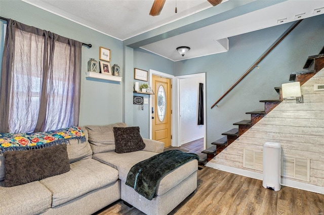 living room with ceiling fan, hardwood / wood-style floors, and a wealth of natural light