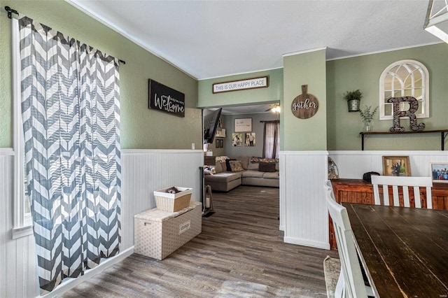 interior space with hardwood / wood-style flooring and crown molding