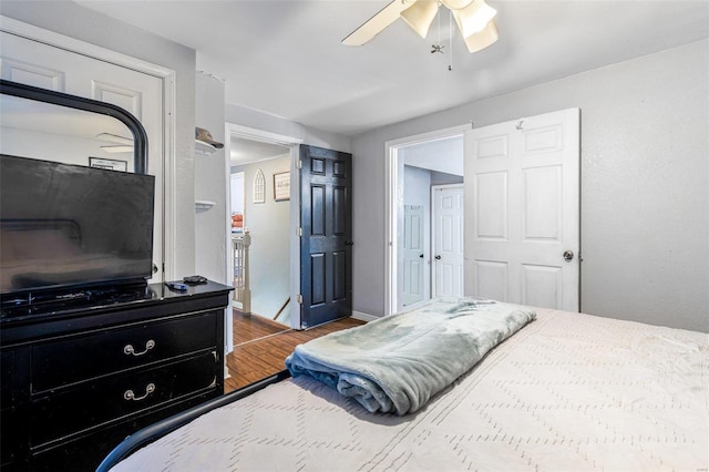 bedroom featuring ceiling fan and wood-type flooring