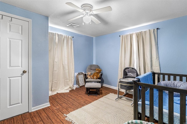 bedroom featuring ceiling fan and hardwood / wood-style flooring