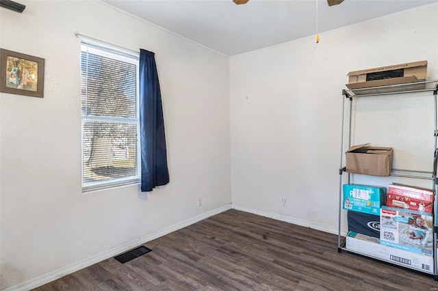 spare room featuring dark hardwood / wood-style floors and ceiling fan