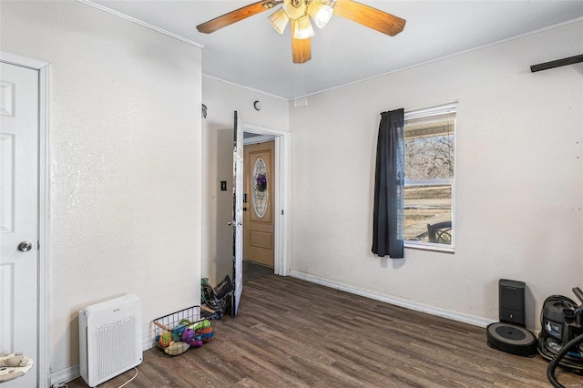 interior space with dark hardwood / wood-style floors and ceiling fan