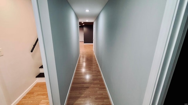 corridor with light wood-type flooring