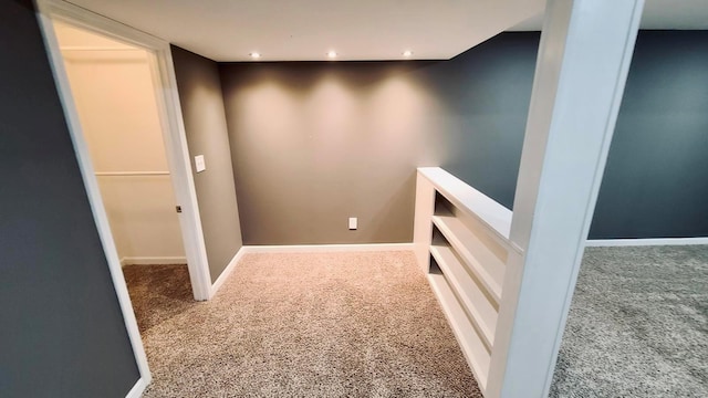 hallway with carpet flooring