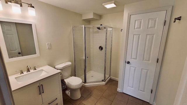 bathroom featuring a shower with door, toilet, tile patterned flooring, and vanity