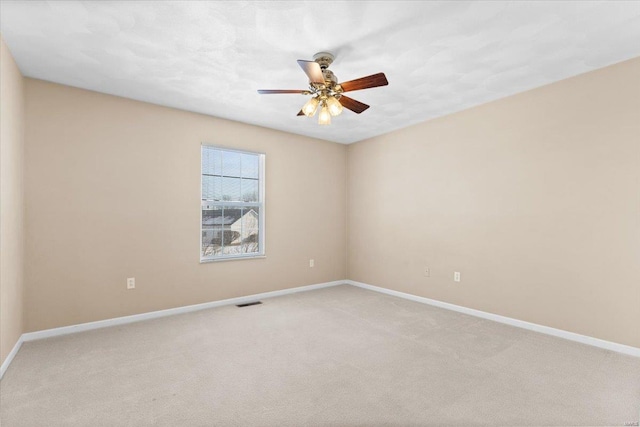 carpeted empty room with ceiling fan