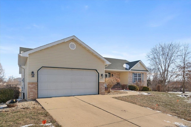 ranch-style home featuring a garage