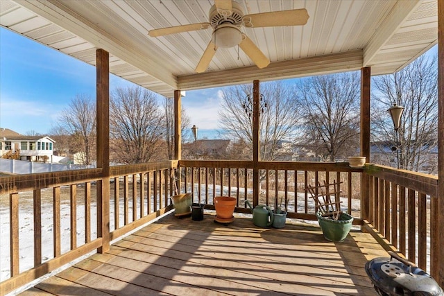 wooden terrace featuring ceiling fan