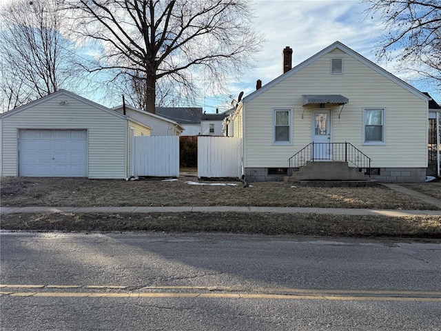 view of front of home with an outbuilding and a garage