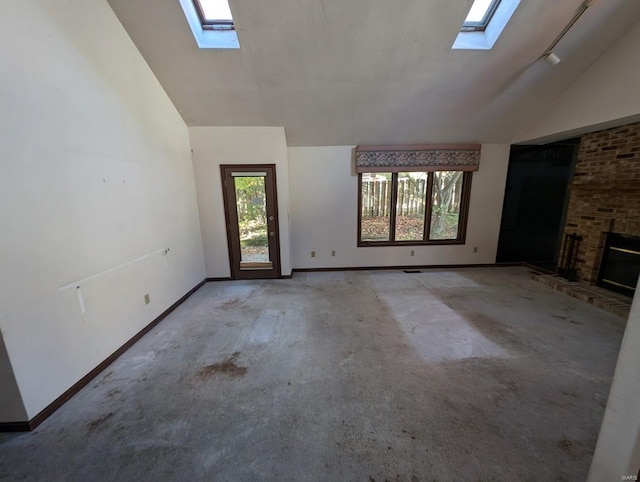 unfurnished living room with lofted ceiling and a fireplace