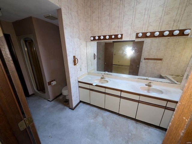 bathroom featuring toilet and vanity