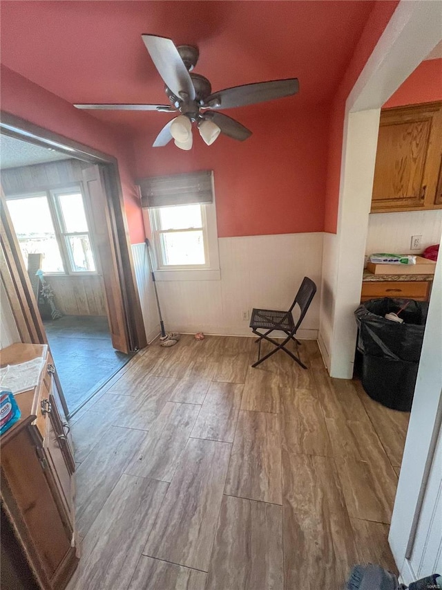 interior space with light hardwood / wood-style flooring and ceiling fan