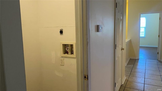 corridor with light tile patterned flooring