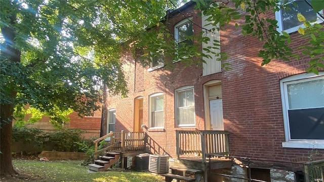 view of side of home featuring cooling unit