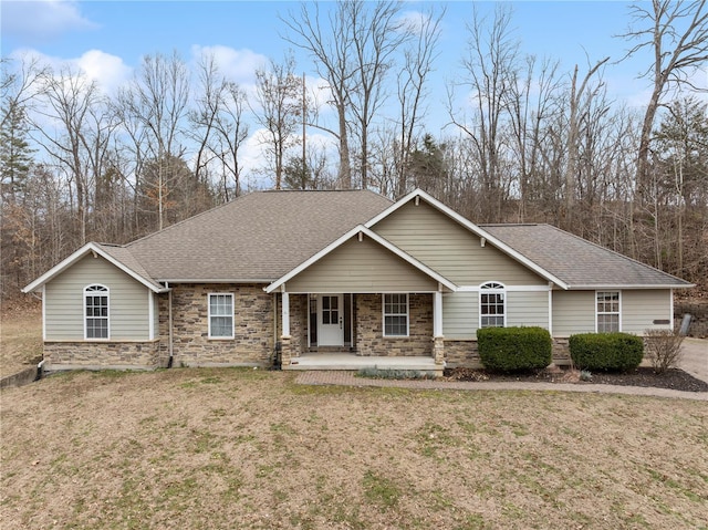 craftsman inspired home with covered porch and a front yard