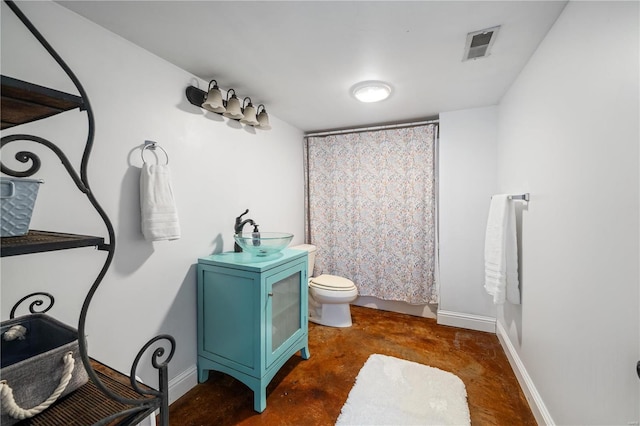 bathroom with vanity, toilet, a shower with shower curtain, and concrete floors