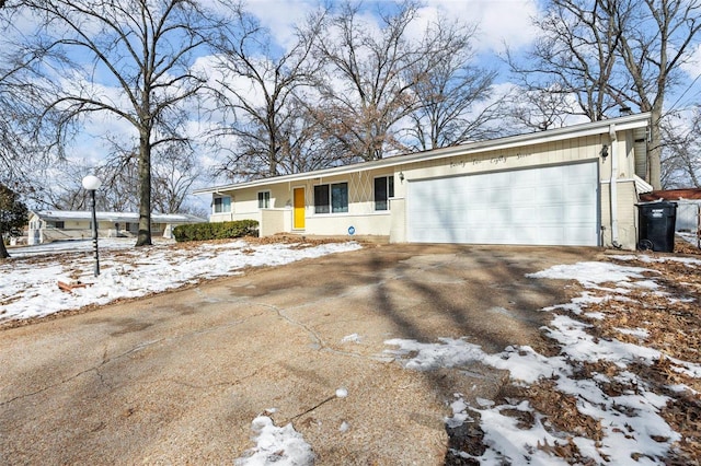 ranch-style home featuring a garage