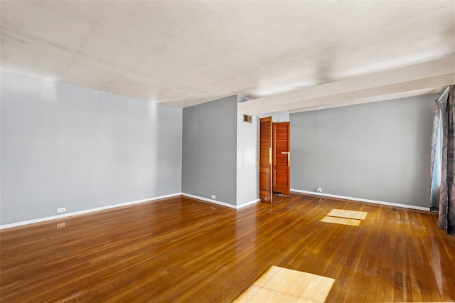 unfurnished room with hardwood / wood-style flooring