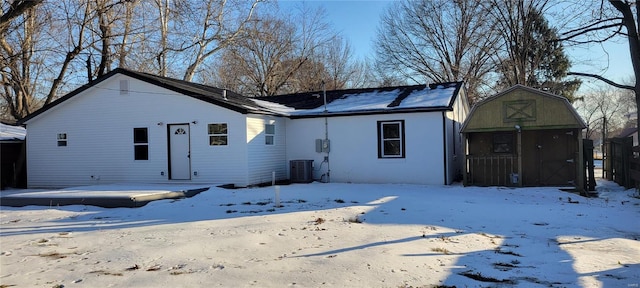 view of front facade featuring an outbuilding and cooling unit