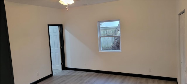 empty room with light hardwood / wood-style floors