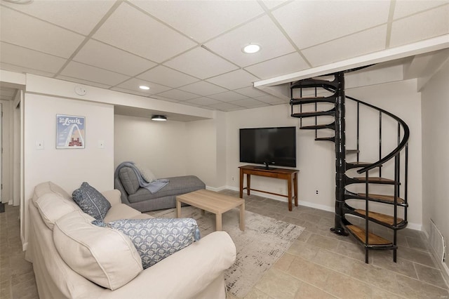 living room featuring a drop ceiling