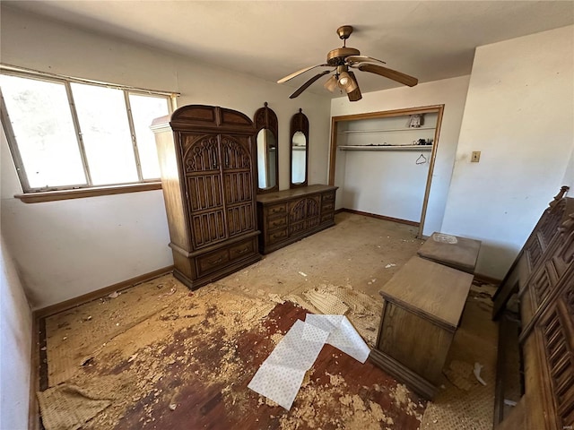 bedroom with ceiling fan and a closet