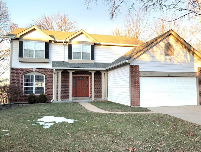 front facade featuring a garage and a front lawn