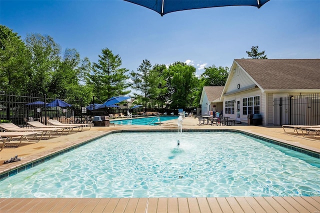 view of swimming pool with a patio