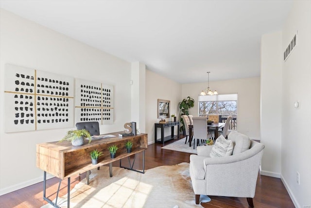 living room featuring hardwood / wood-style flooring and a chandelier