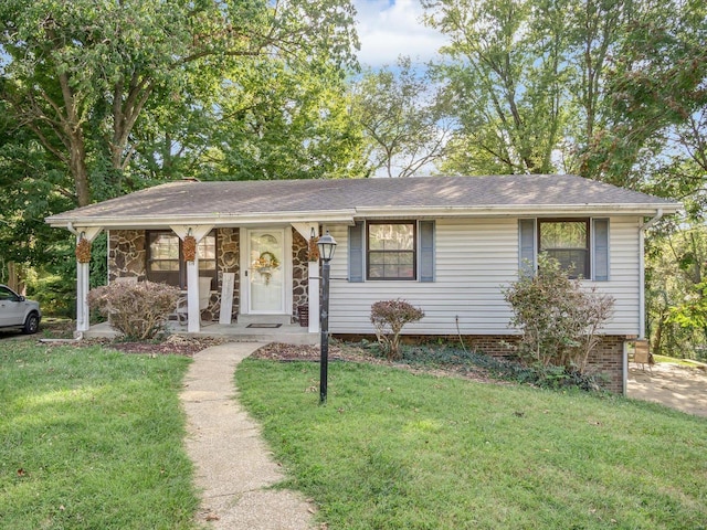 view of front of home featuring covered porch and a front yard