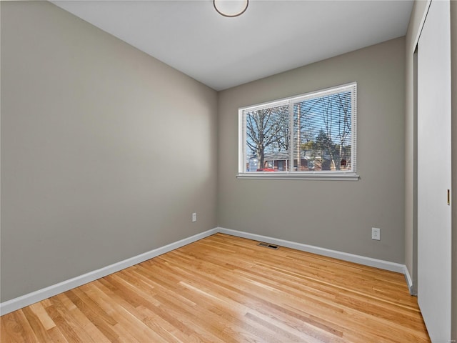 unfurnished room featuring light hardwood / wood-style flooring