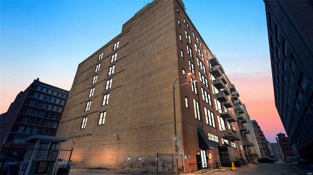 view of outdoor building at dusk