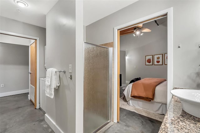 bathroom featuring concrete flooring, vanity, and a shower with door