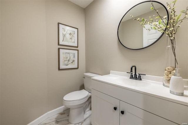 bathroom with toilet and vanity