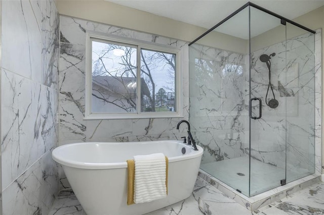 bathroom with tile walls and independent shower and bath