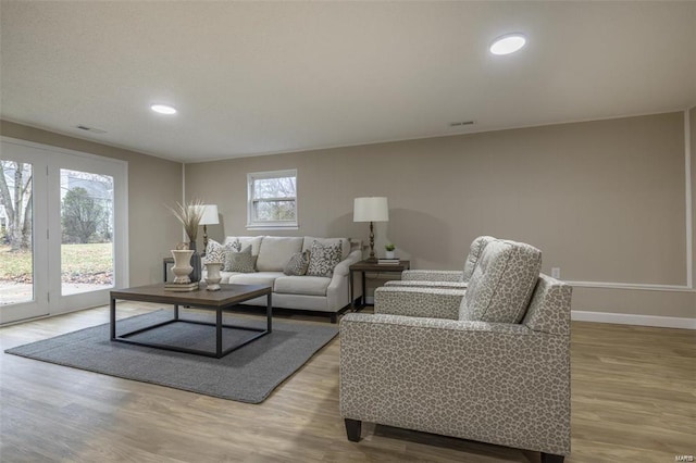 living room with light hardwood / wood-style floors