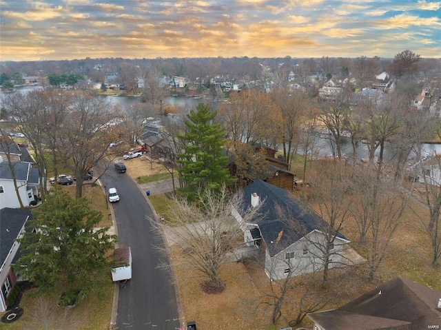 aerial view at dusk with a water view