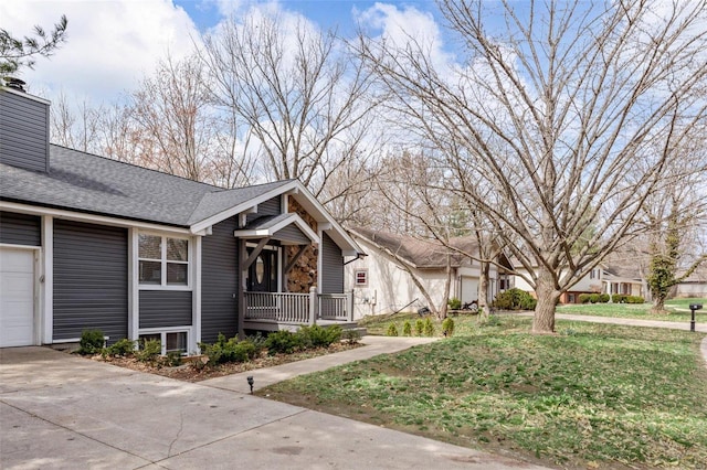 view of front of house with an attached garage, a porch, roof with shingles, a chimney, and driveway