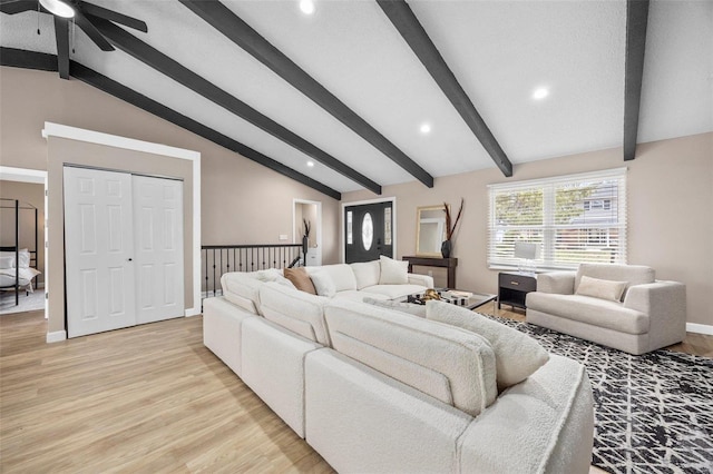 living room featuring a ceiling fan, baseboards, lofted ceiling with beams, recessed lighting, and light wood-type flooring