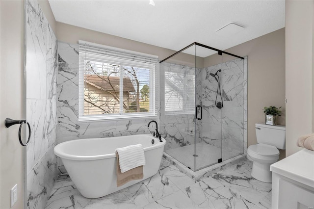 full bath featuring a marble finish shower, a freestanding tub, a textured ceiling, toilet, and marble finish floor