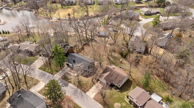 bird's eye view with a residential view and a water view