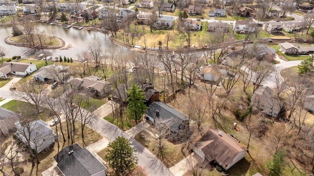 drone / aerial view featuring a residential view and a water view