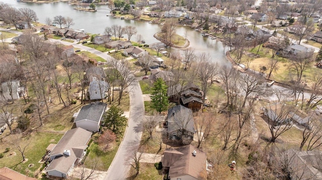 birds eye view of property with a residential view and a water view