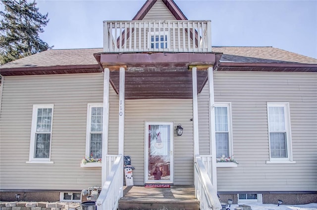 view of front of home with a balcony