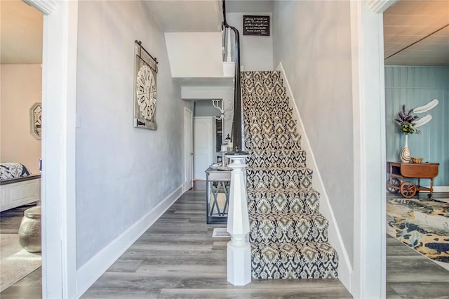 stairway with hardwood / wood-style flooring