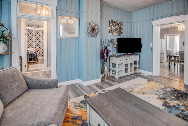 living room featuring hardwood / wood-style floors and an inviting chandelier